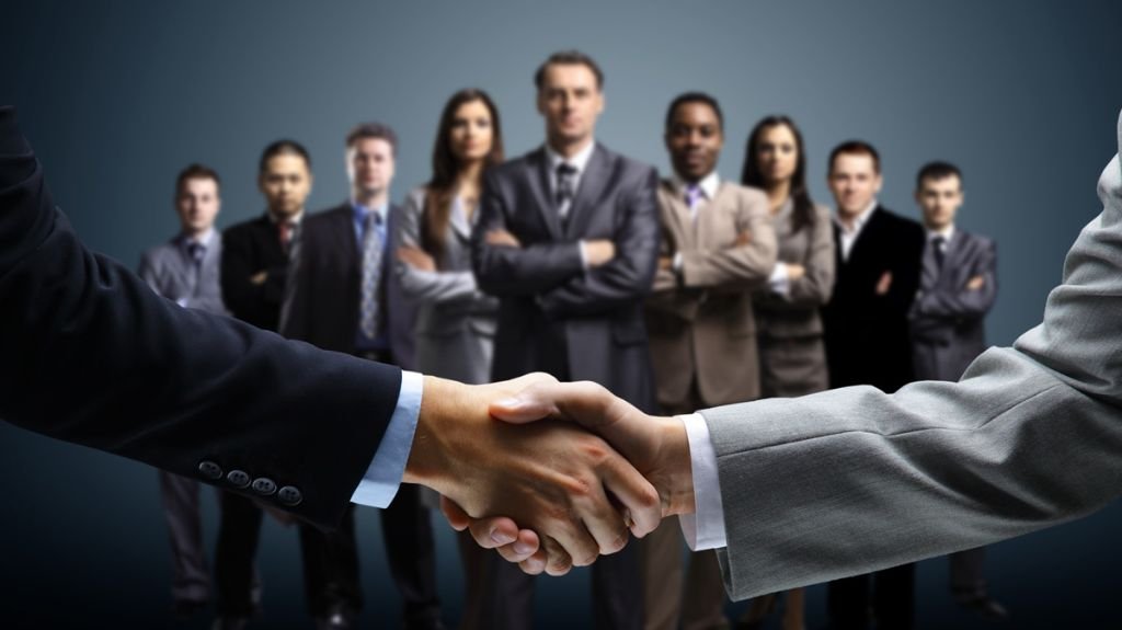 Business partnership handshake